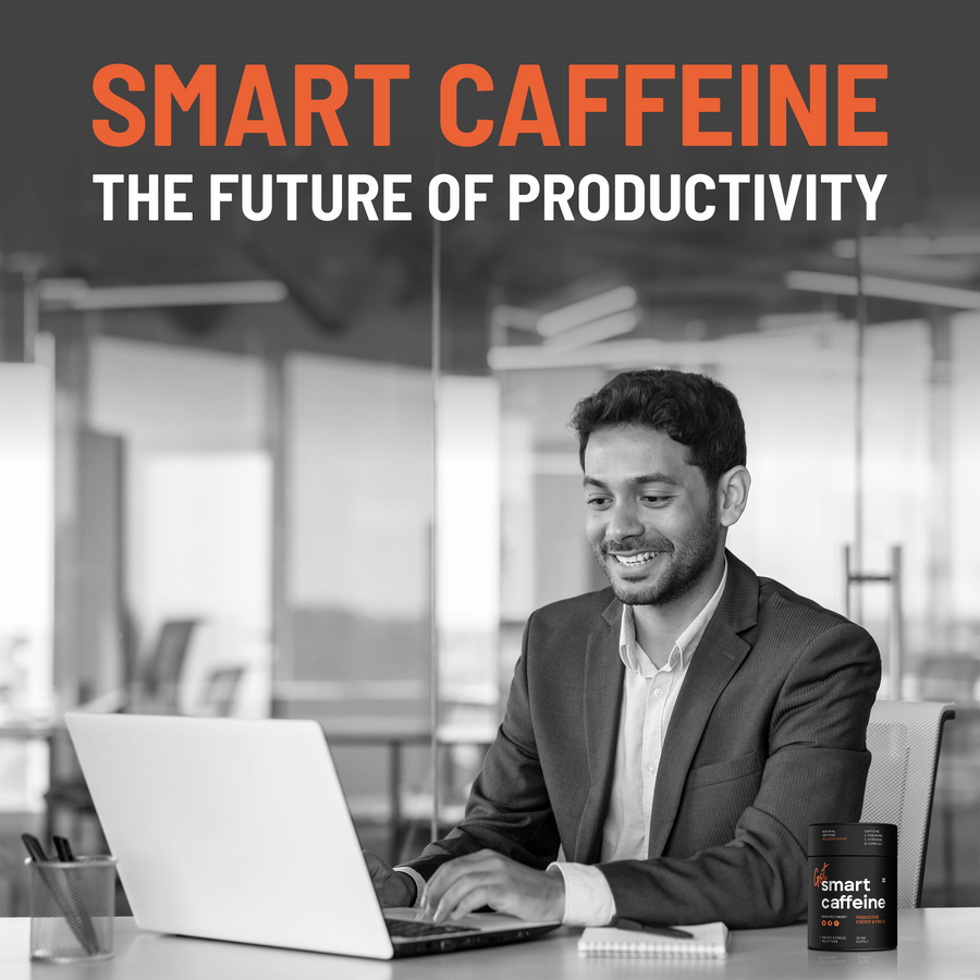Professional working at laptop with Smart Caffeine tub - the future of productivity nootropic supplement